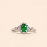 ANILLO ORO BLANCO 10K ESMERALDA CORTE OVAL 6X5MM .18PTS DIAMANTE